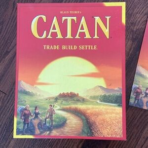 Catan board game, opened but not played. Resource cards still in wrapper.